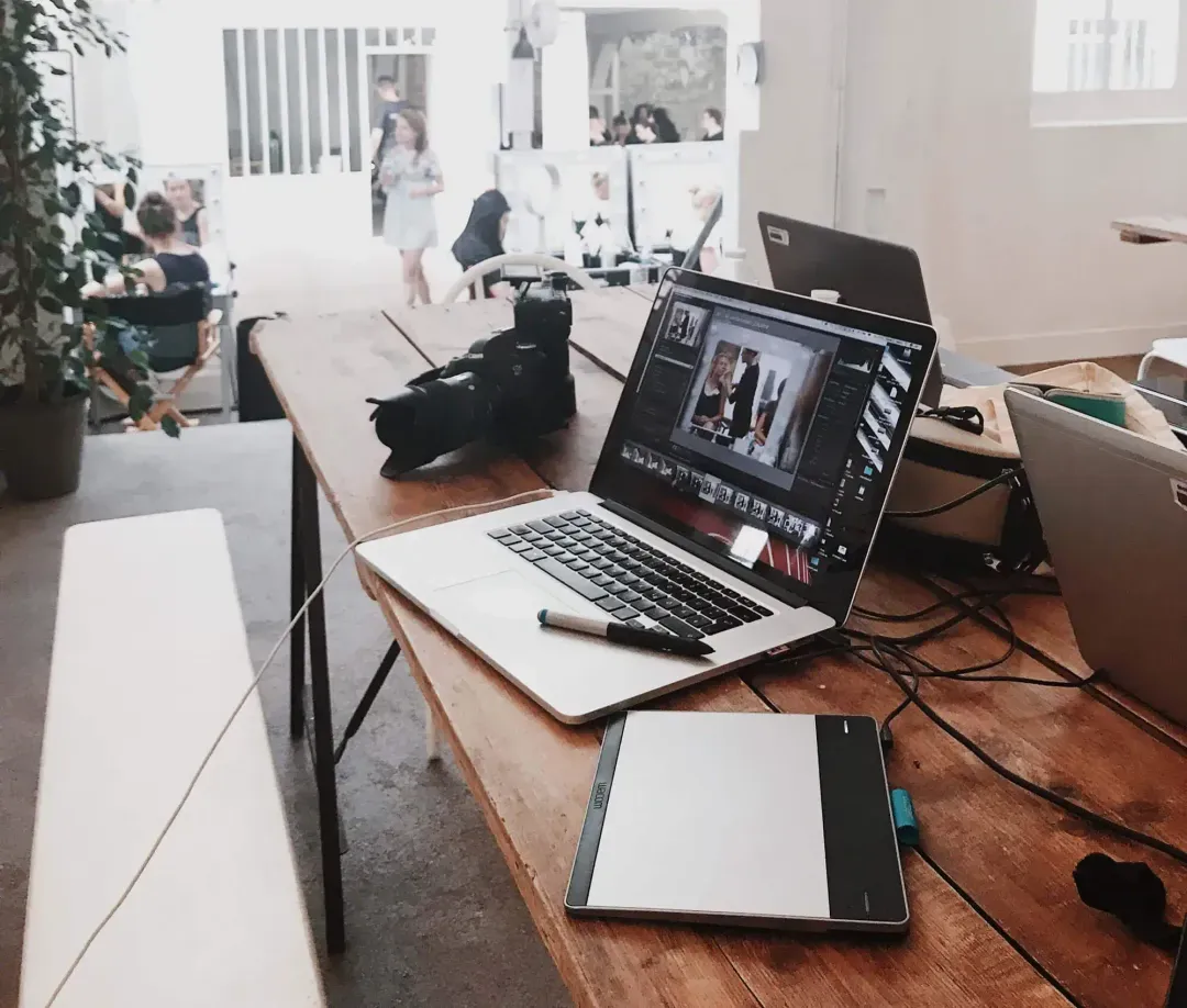 A laptop an a drawing tablet on a desk