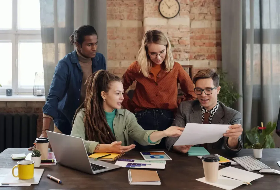 A group of people sharing ideas working